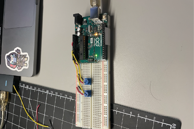 In this image, I was developing the Arduino to have multiple inputs. Here I started with 2 Potnometer inputs that are connected to the Arduino.